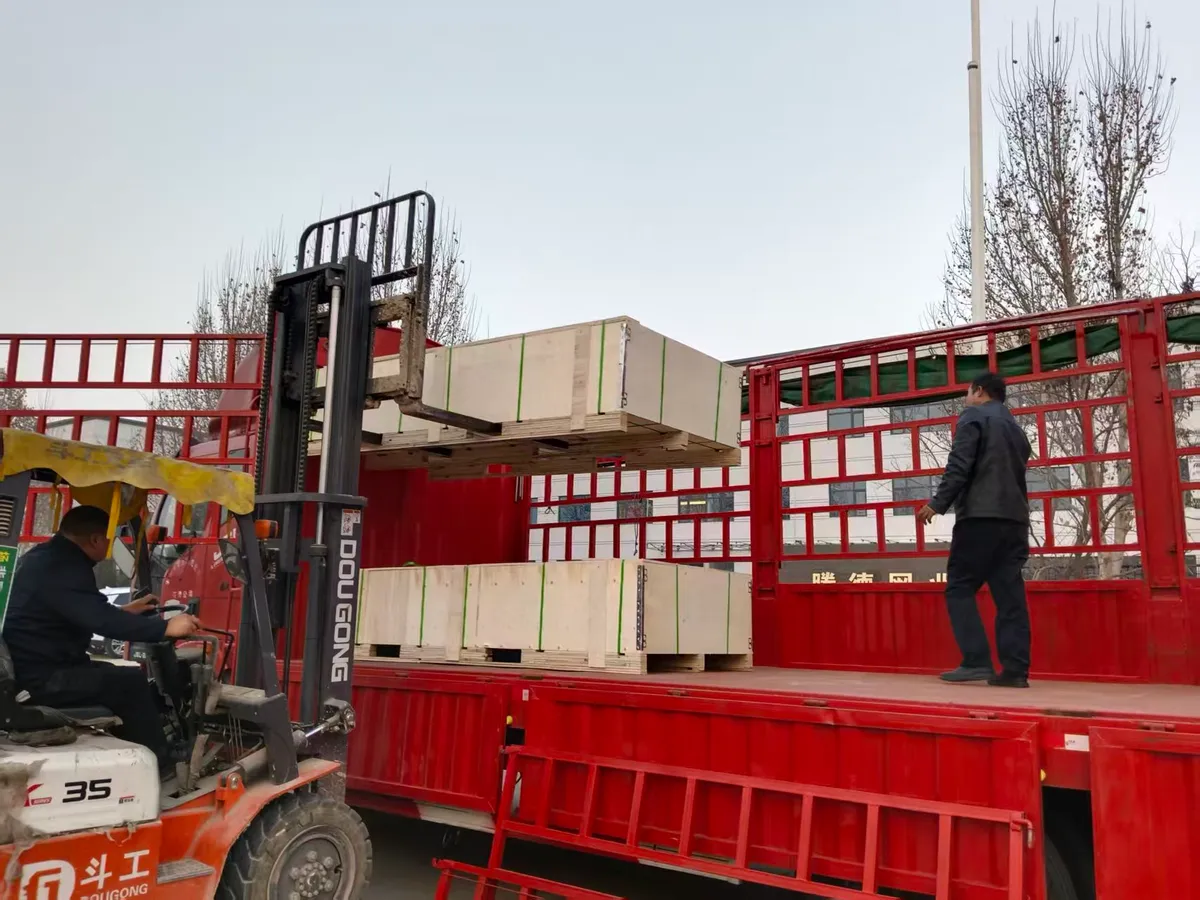 Wooden export crates being loaded at the factory
